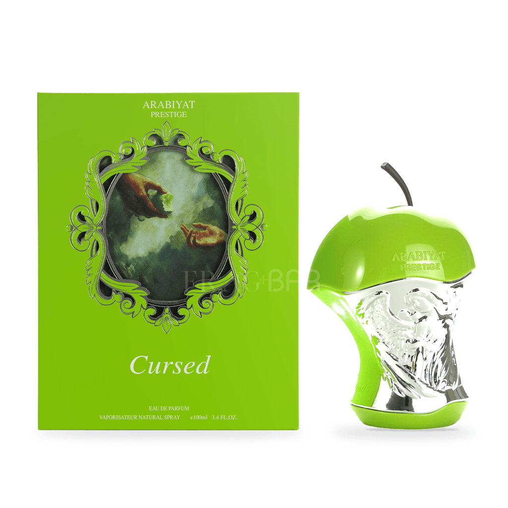 Cursed by Arabiyat Prestige 100ml perfume in a green and silver apple-shaped bottle beside its matching box on a white background.